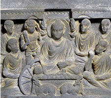 Stone relief depicting the Buddha's first sermon